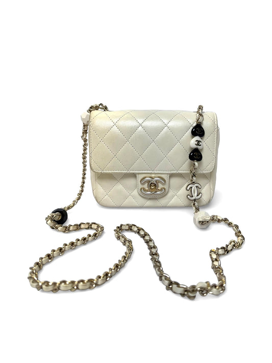 Chanel white iridescent lamb charm mini limited edition flap